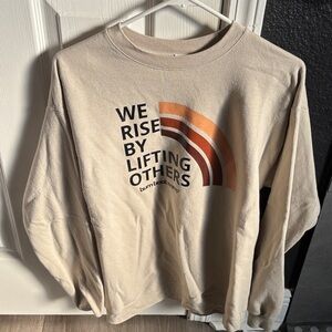 Neutral Beige Graphic Crewneck Sweatshirt - 'We Rise By Lifting Others'